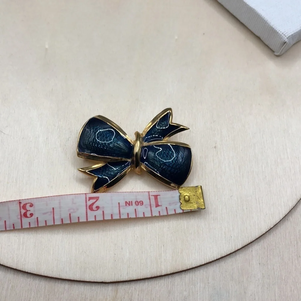 Vintage enamel fancy  bow brooch, textured look